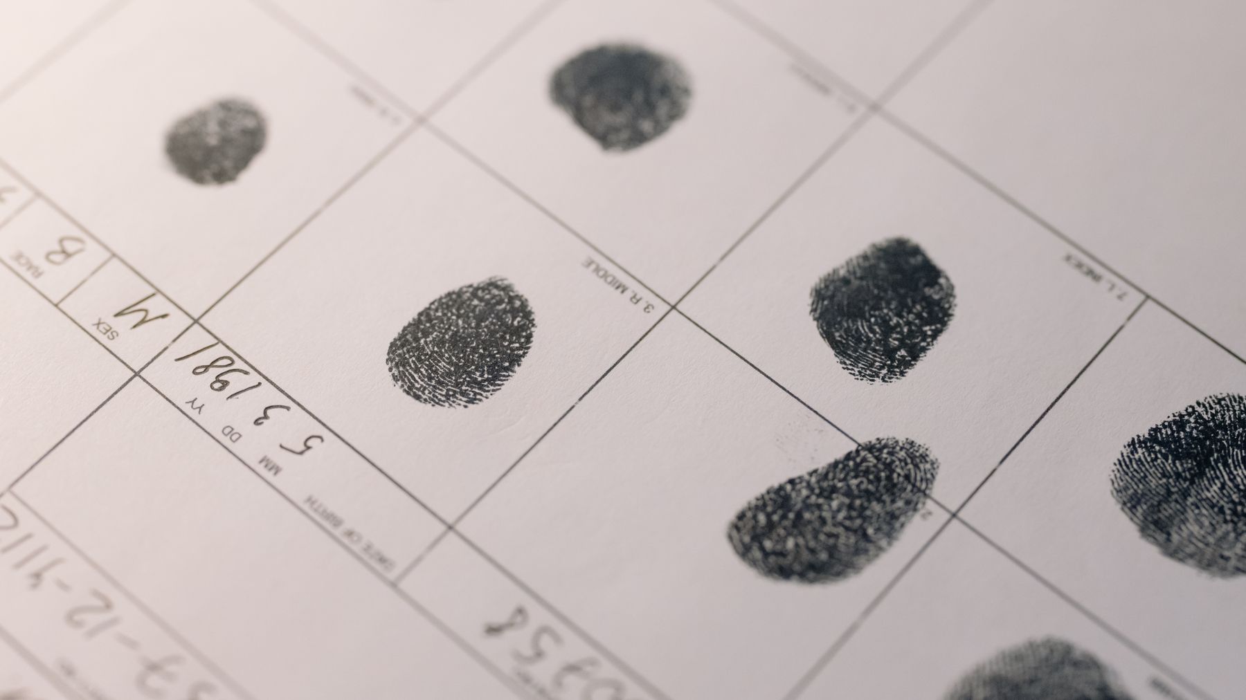 A fingerprint card with inked prints in labelled boxes