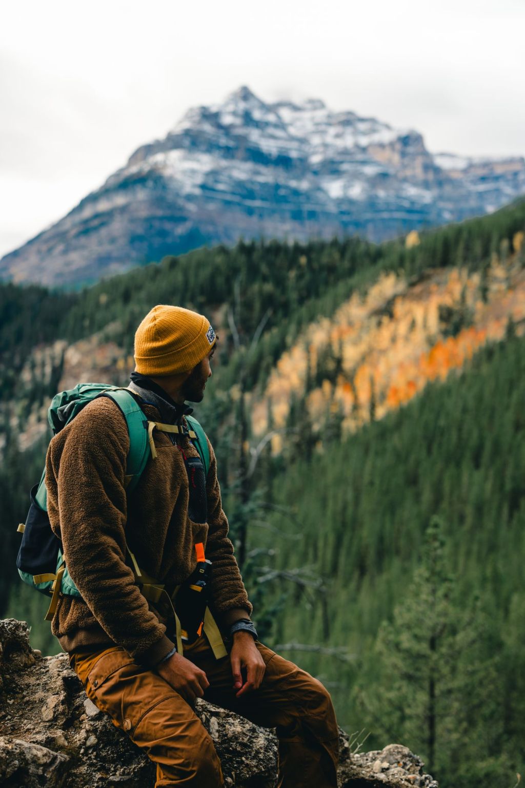 A hunter looking out over a mountain ridge