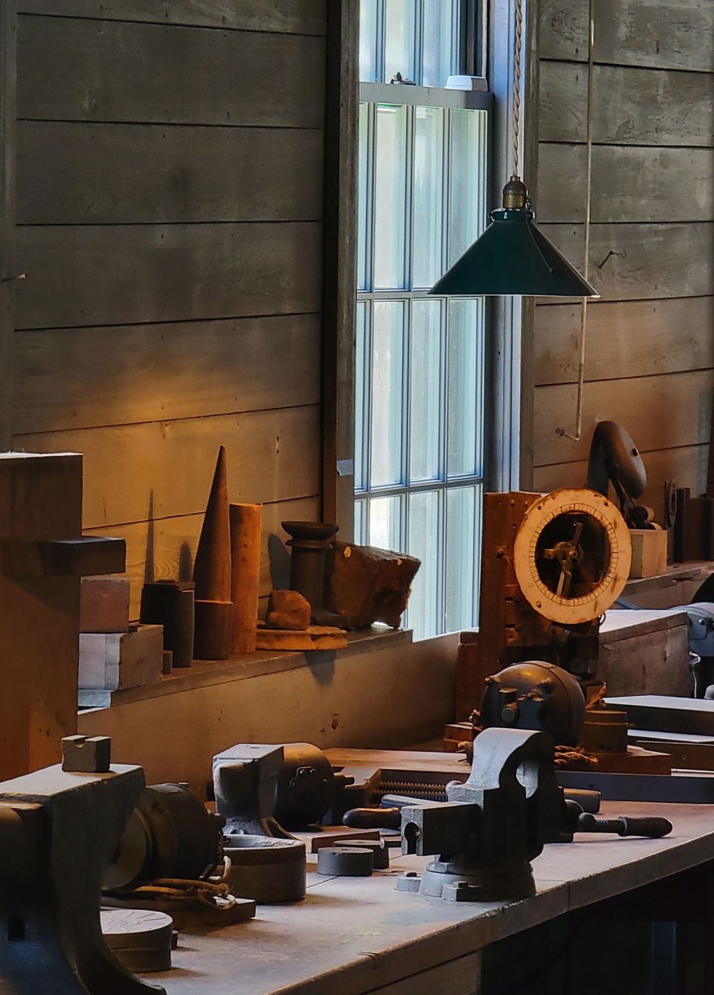 Tools hanging above a rustic workbench