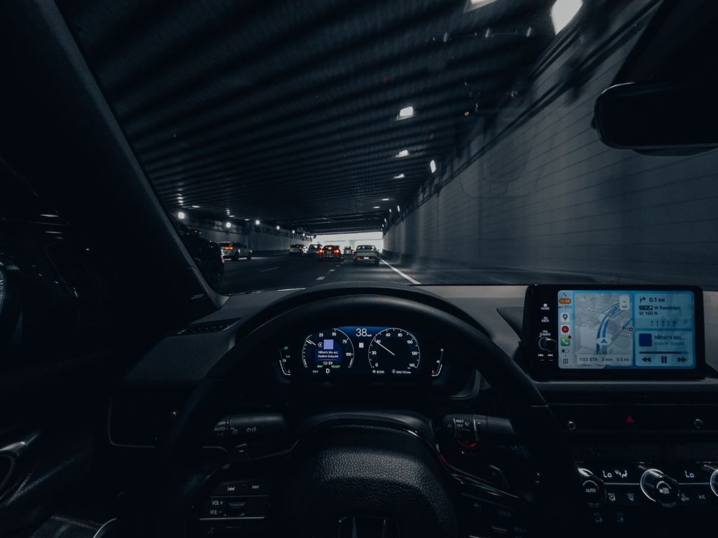 A vehicle dashboard lit at night