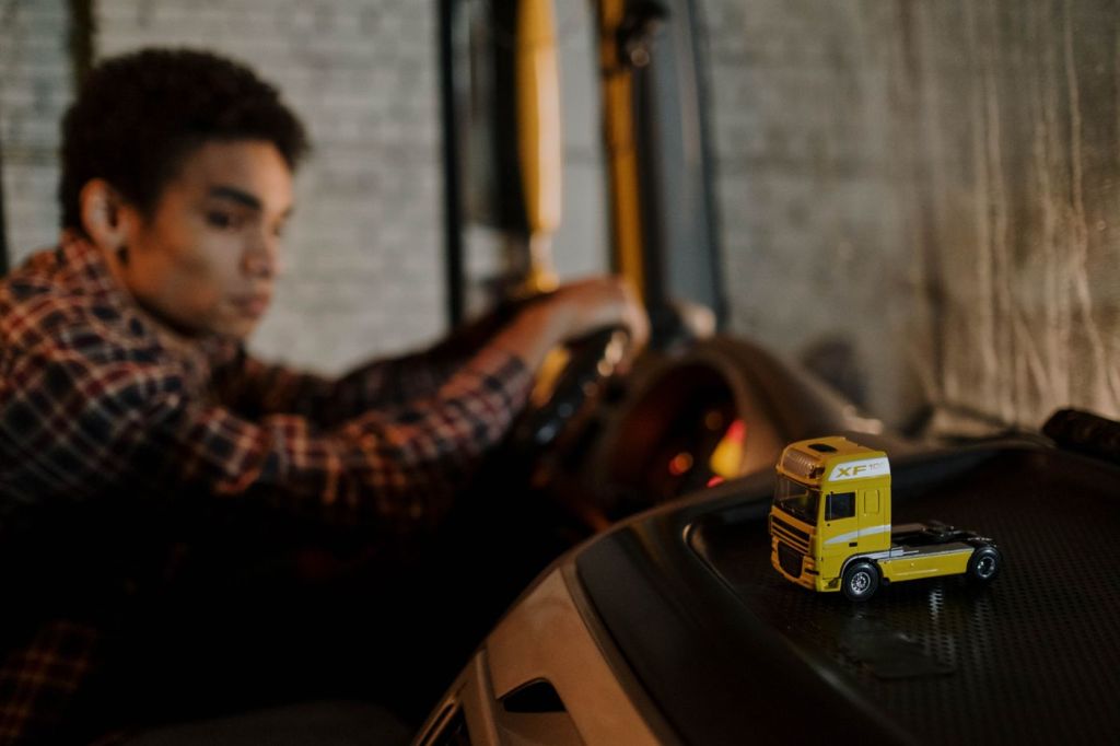 A driver at the wheel of a truck