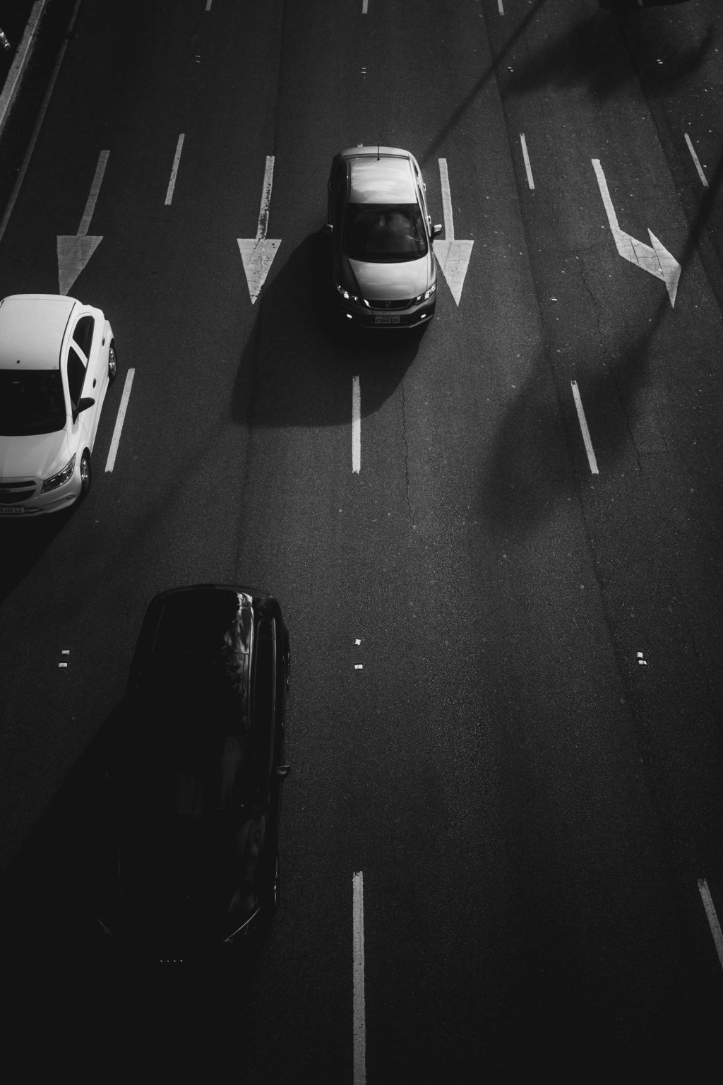A pickup truck on a dark road at night